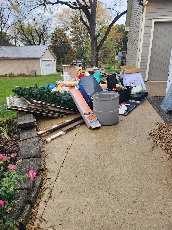 Dumpster being loaded with debris for Demolition Dumpster Rental in Orchard Park